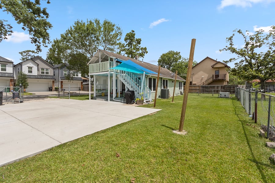 Parking area accommodates 3 small/med vehicles. BBQ pit next to back deck.