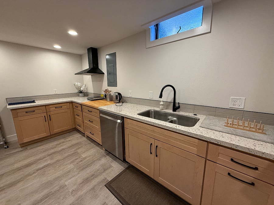 new kitchen with dishwasher, induction, hood,  large pantry, lots of cabinets, coffeemaker, tea kettle, micro, toaster oven and refrigerator.