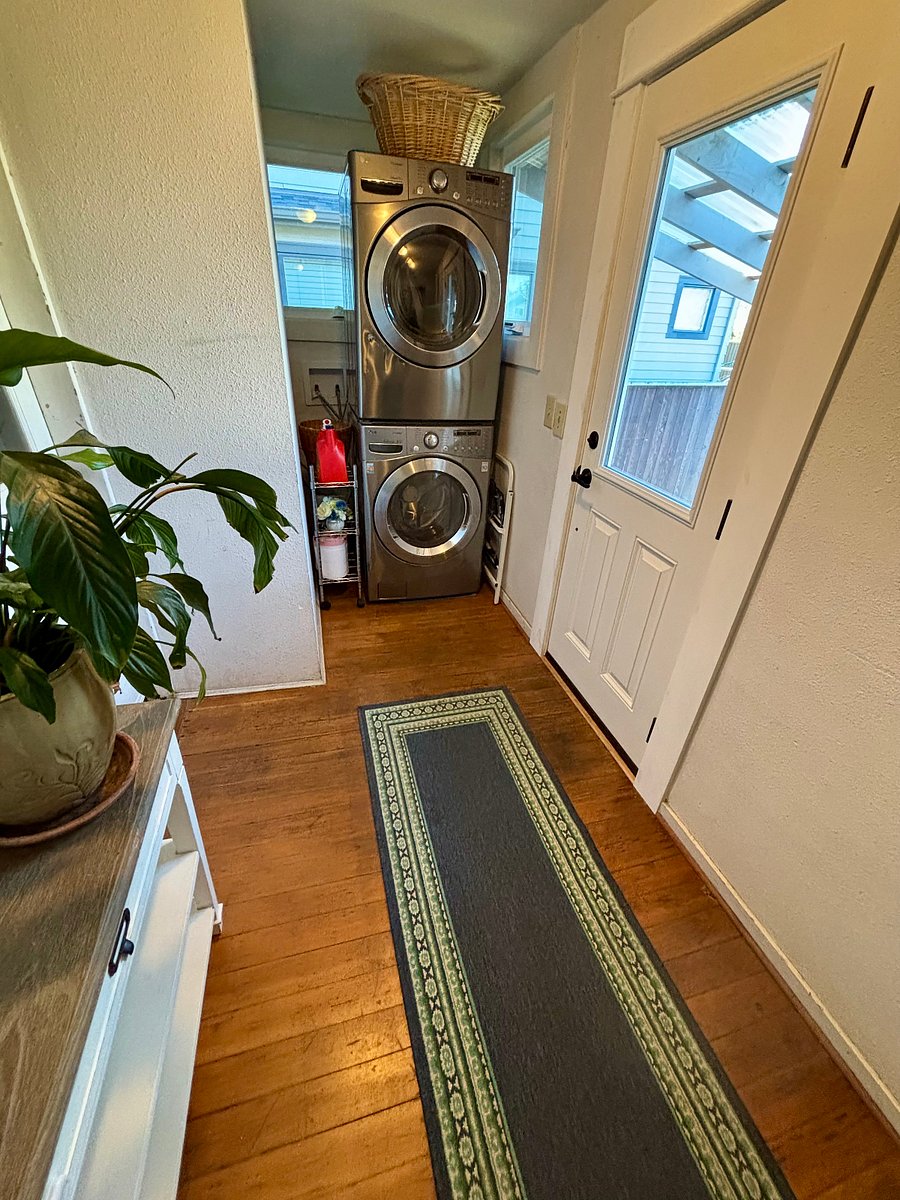 Shared lower-level laundry area by the semi-private entrance to your upstairs suite. This mudroom is separated from the rest of the house by another door.