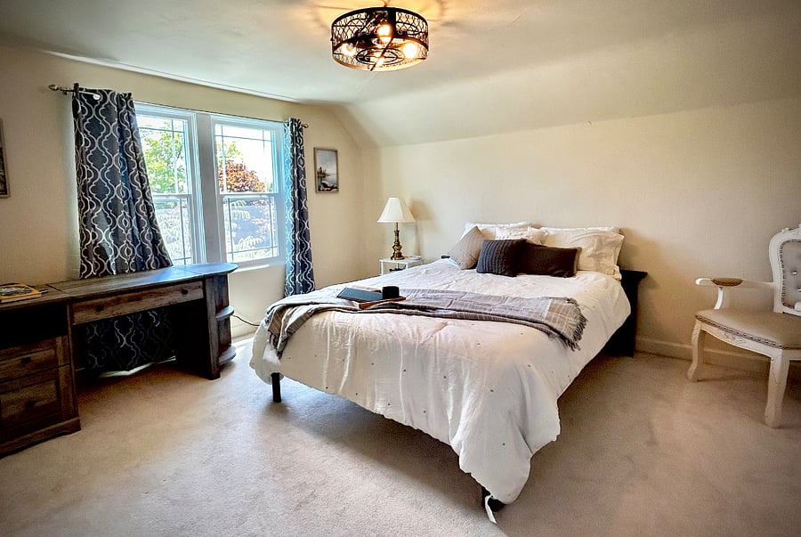 Extra large upstairs queen bedroom with flex top desk. View of Mt Shasta!