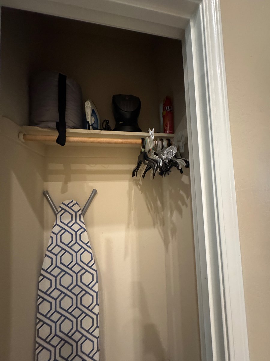 Coat closet with iron/ironing board