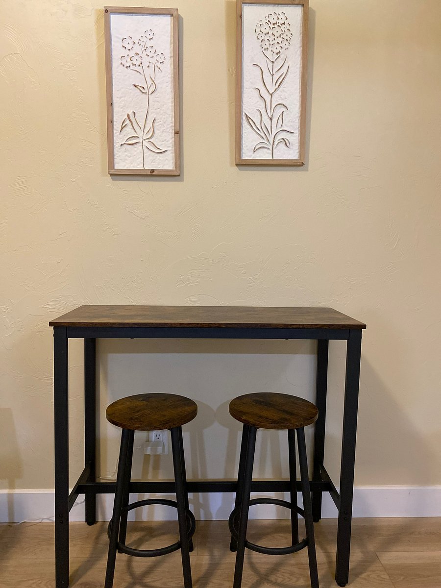 Bar height table with two stools
