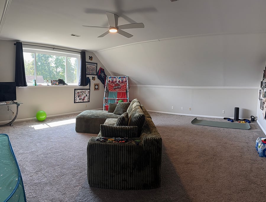 This shared space is part-time bonus room, part-time grandkids playroom.