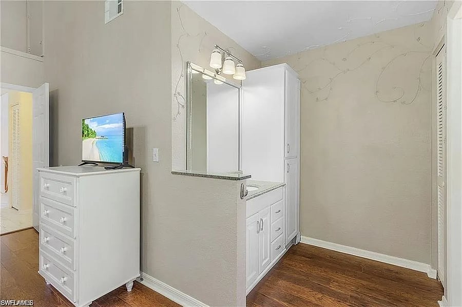 PLEASE NOTE: TV photoshopped in by photographer for Zillow listing. There is no TV in this bedroom.