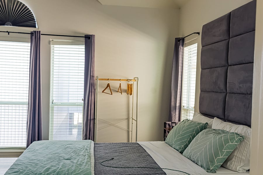 Side table and a portable closet with a bottom shelf forfolded clothes