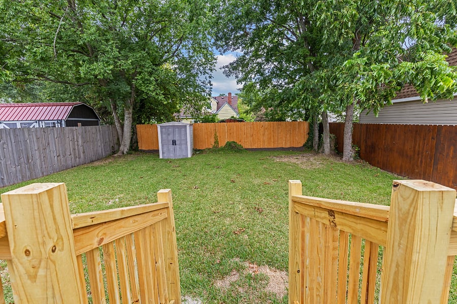 The fully fences spacious backyard is perfect for a pet or to spend time outside. The shed can be used for guest storage as well.