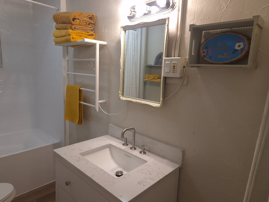 Shower with deep soak tub, heated towel warmer, and Bluetooth fan/light so you can continue singing in the shower.