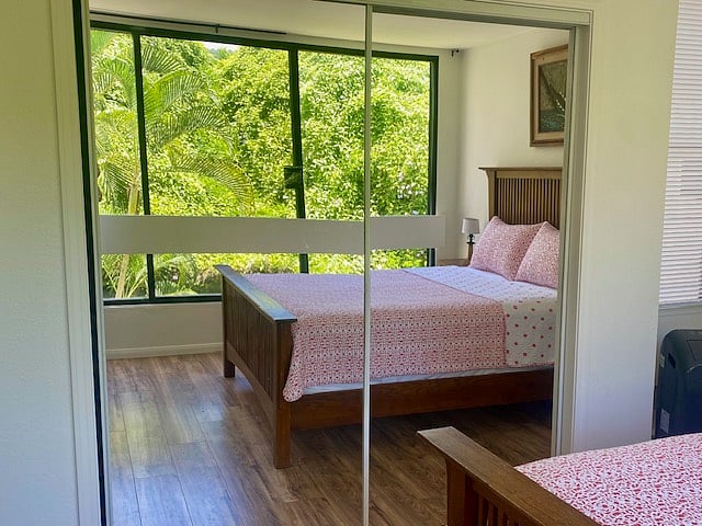 Large, mirrored closet with sliding doors. AC floor unit in the bedroom.