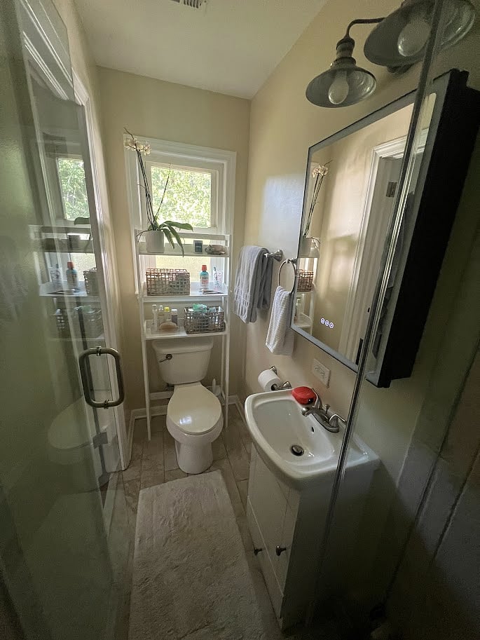 King bedroom en suite bathroom with standing glass shower