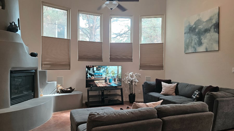 Living room with Kiva fireplace, large smart TV & comfortable couches & blankets to cozy up.