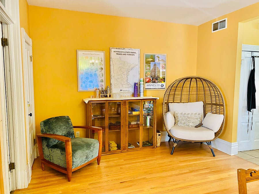 Cocktails, board games, books and lounging chairs in area off dining room