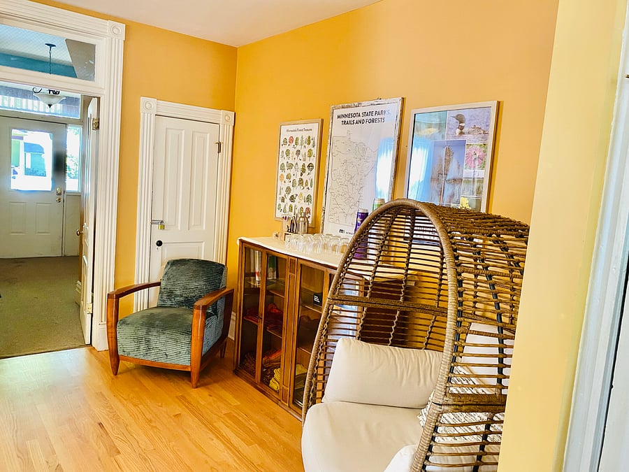 View of cocktail area and front entryway from kitchen