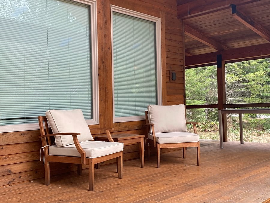 Wraparound porch with sitting area and bbq