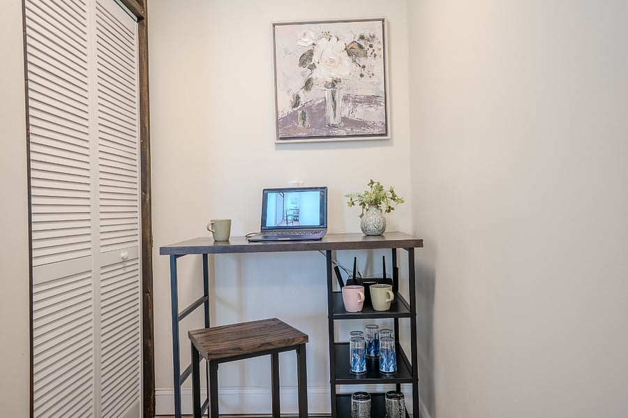 First floor living area with Smart TV, Sofa and arm chair, Coffee station that can be conveniently switched to working space.