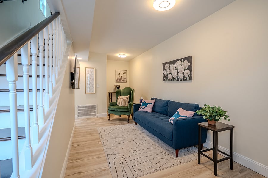 First floor living area with Smart TV, Sofa and arm chair, Coffee station that can be conveniently switched to working space.