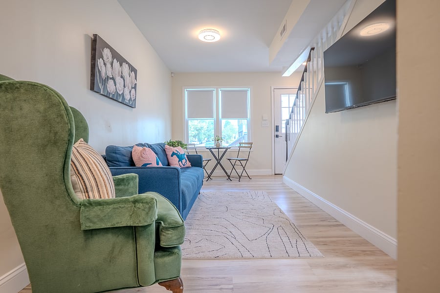 First floor living area with Smart TV, Sofa and arm chair, Coffee station that can be conveniently switched to working space.