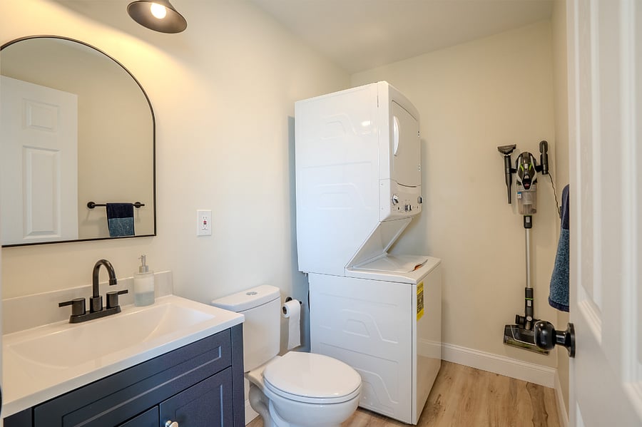 First Floor half bath with full stackable washer and dryer