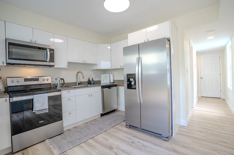 Kitchen with all new (2024), refrigerator with built in water and ice dispenser, microwave, oven, electric stove top and dishwasher