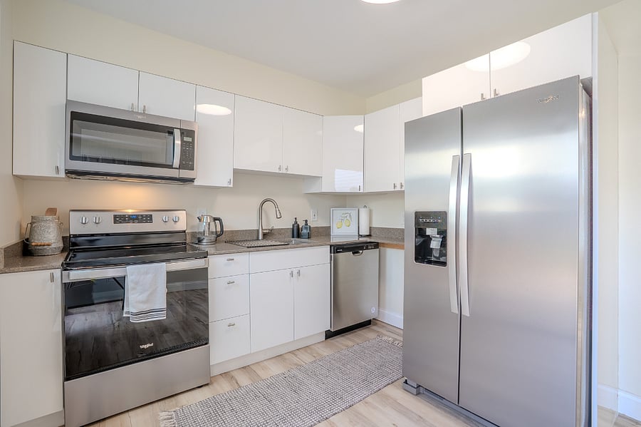 Kitchen with all new (2024), refrigerator with built in water and ice dispenser, microwave, oven, electric stove top and dishwasher