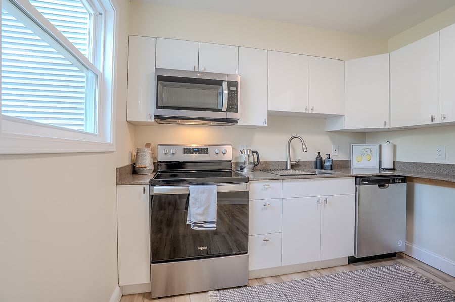 Kitchen with all new (2024), refrigerator with built in water and ice dispenser, microwave, oven, electric stove top and dishwasher