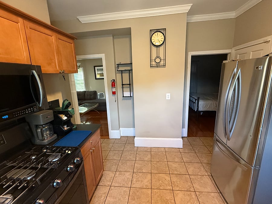Full size kitchen with full size refrigerator, gas stove/oven, sink, dishwasher, and access to the washer and dryer. 