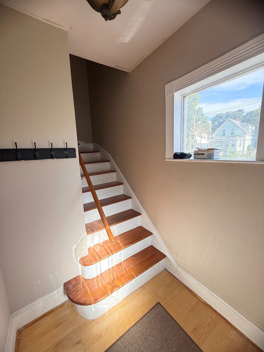 Foyer area for coats and shoes.