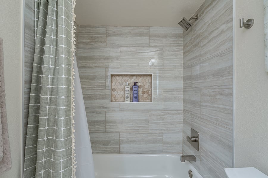 shared hall bathroom with tub