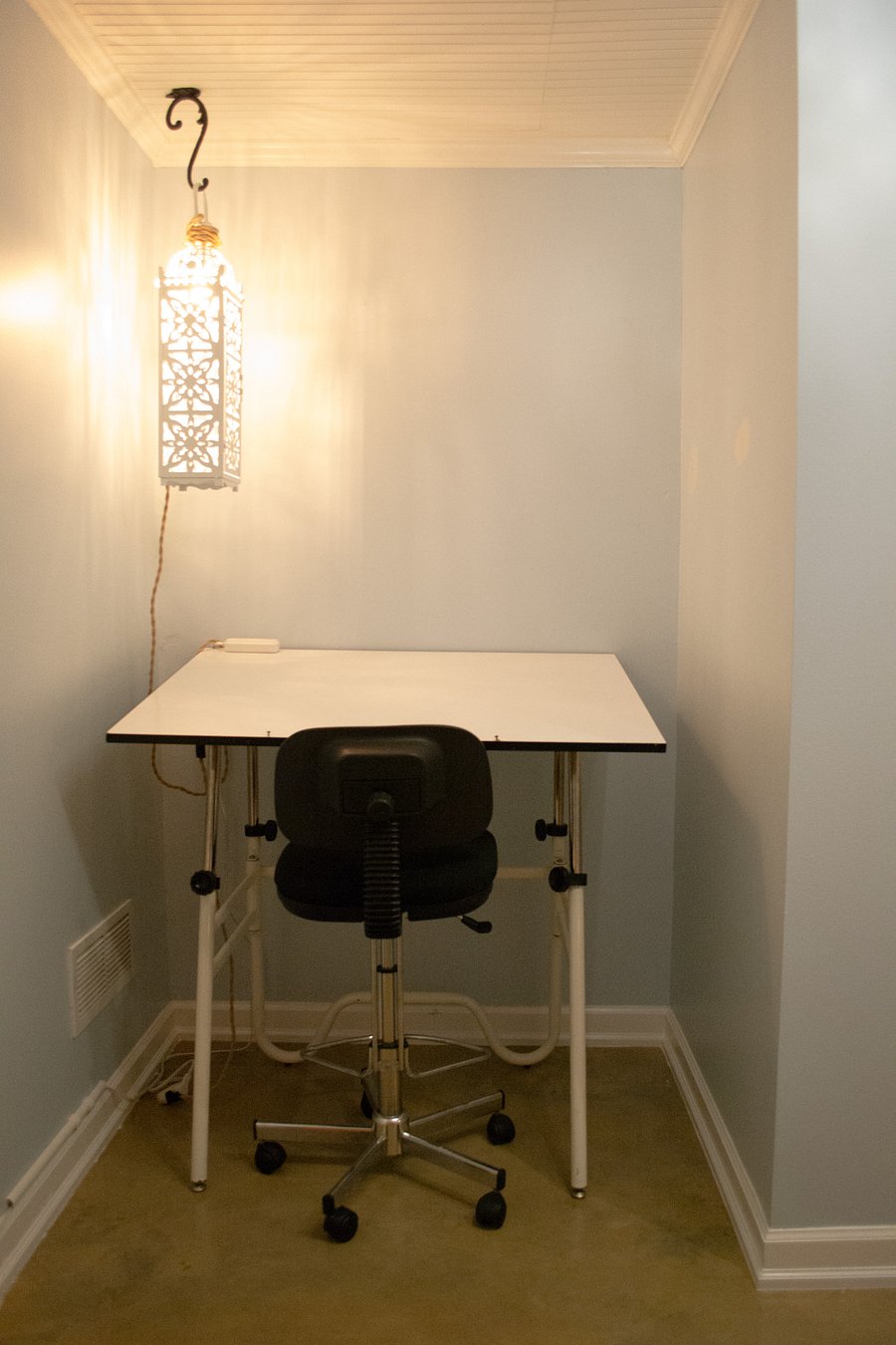 This is a big drafting table. It has a lot of space for a big computer monitor, a laptop, and more. Height and table angle are adjustable.