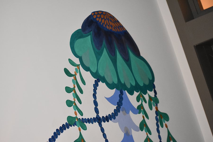 We commissioned Laura Lashley--a muralist from Winston-Salem NC--to paint whimsical jellyfish up the length of the stairwell.  