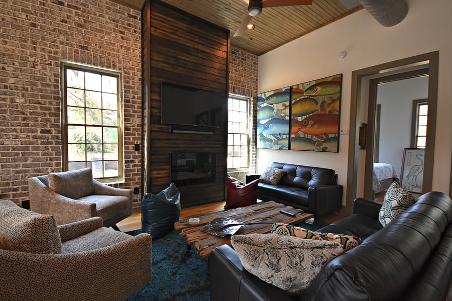 another view of living room, you can see the downstairs queen bedroom through the doorway