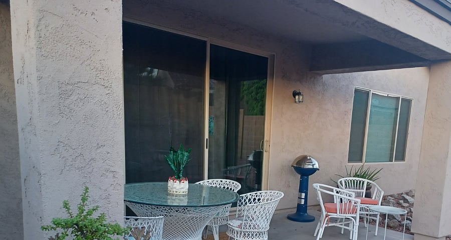 The patio is off of the living room.