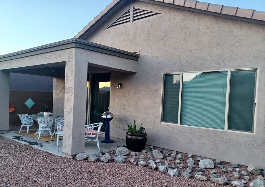 Enjoy mid century modern patio furniture and an electric grill.