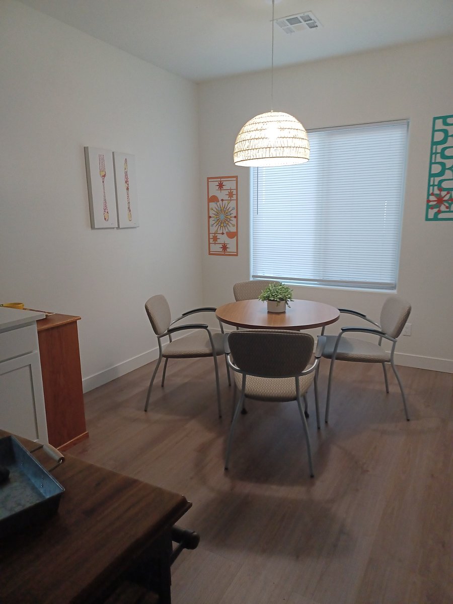 This dinette area is in the kitchen. There is a larger dining area in the open living space.