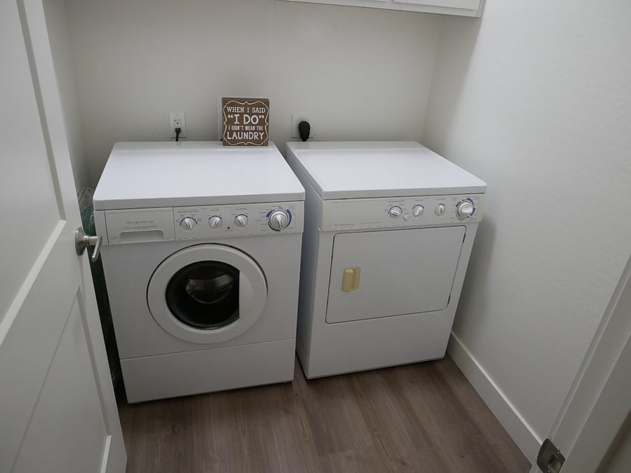Convenient laundry room. 
