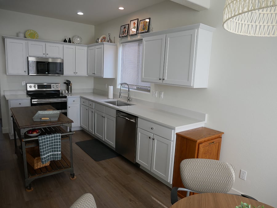 The kitchen island provides more workspace. 