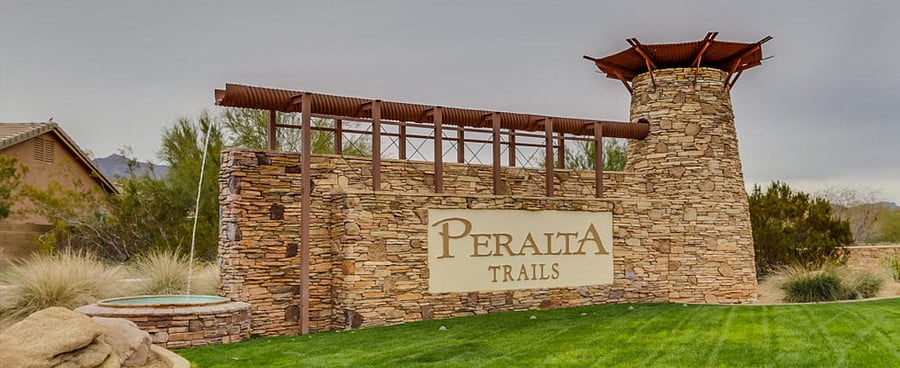The house is located inside the gated Peralta Trails community.