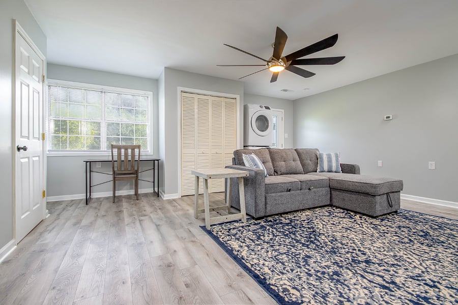 Spacious living room and desk included under bay window for ample natural light!