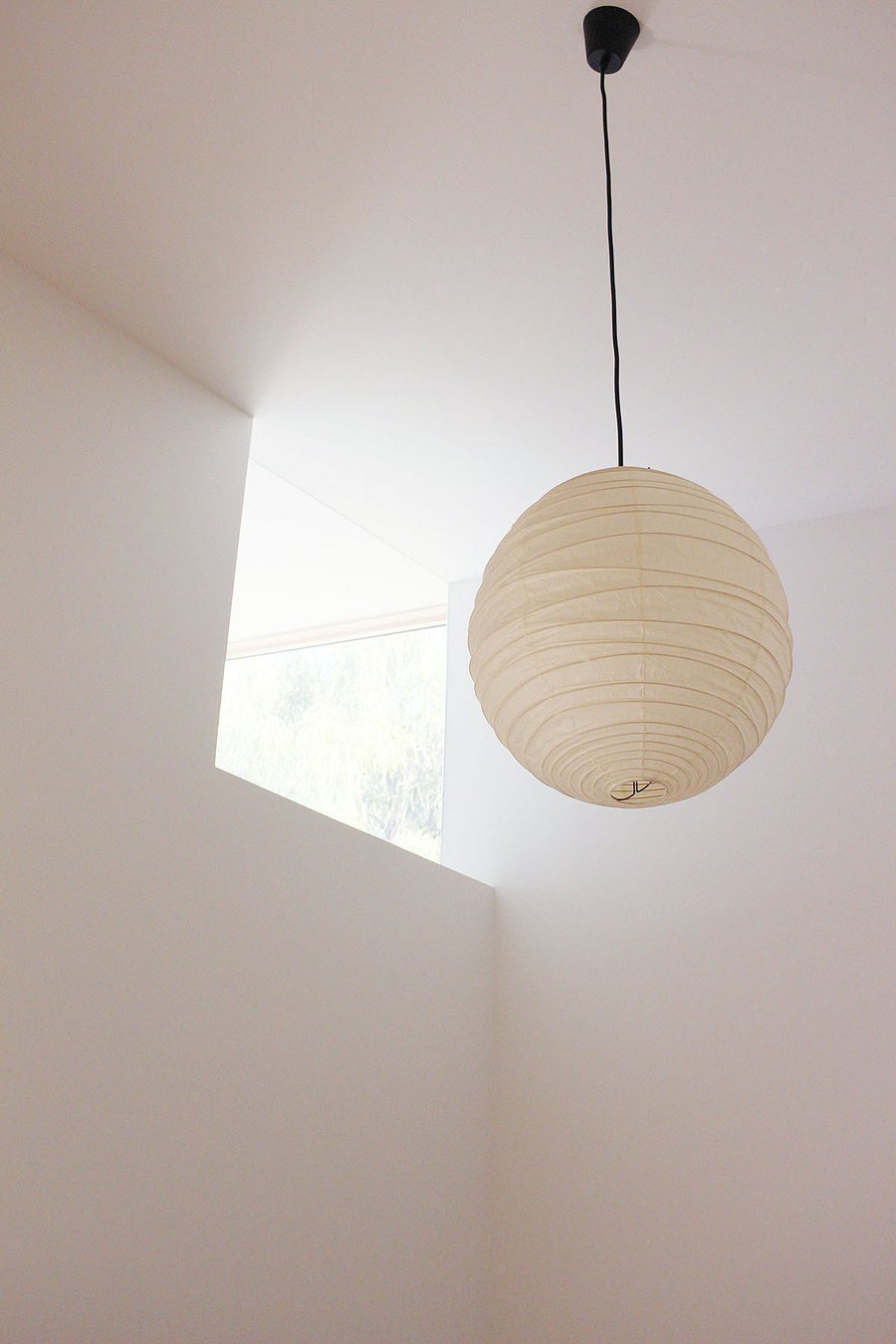 Noguchi pendants in bedroom and dining room