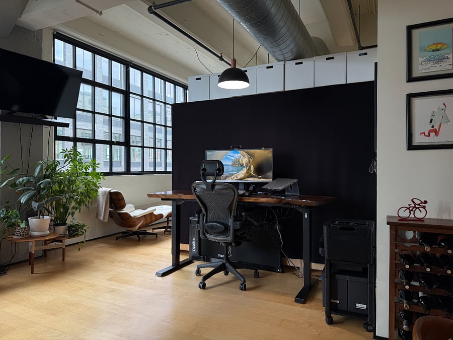 Standing desk with large monitor, docking station, walking pad, and a printer that works when it feels like it.