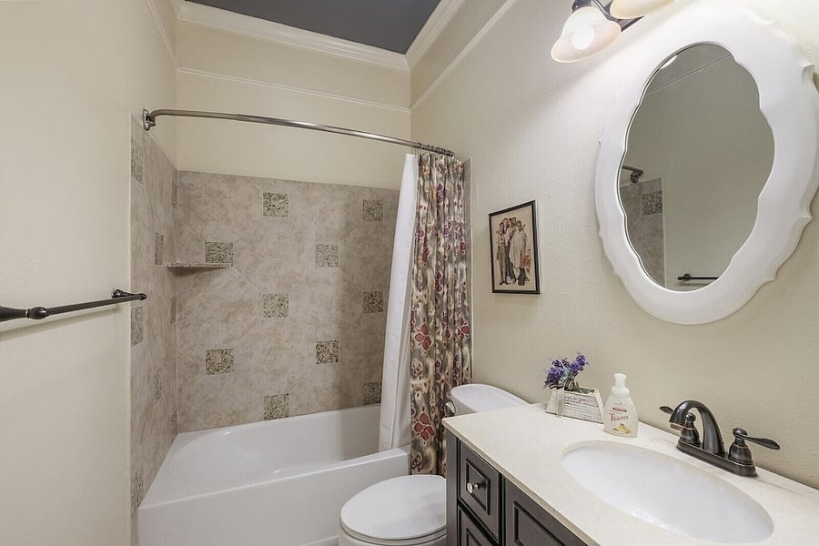 Second bathroom is shared in a hallway with second and third bedrooms