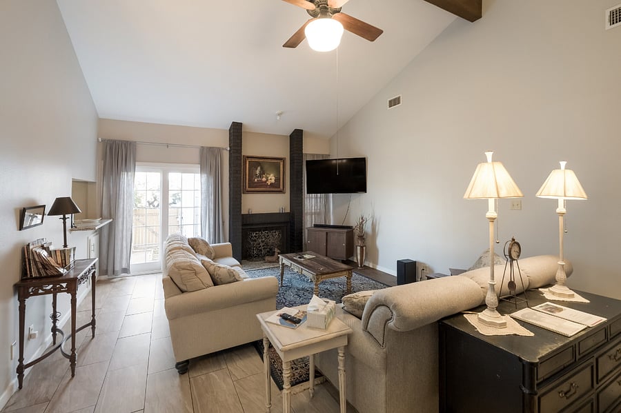 Two couches in living room which makes it comfortable space for watching the large smart TV