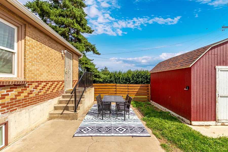 Private Entry + Outdoor Space. Your own entrance leads to a cozy outdoor dining area with rug and table, plus access to a secure shed, perfect for storing skis, paddle boards or other adventure gear. 