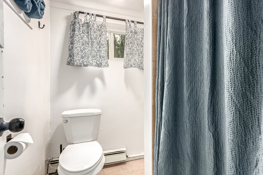 Stylish, stocked bathroom- compare yet thoughtfully designed with modern decor, lush towels, a full shower and essentials like hand soap, cotton balls, and q-tips for a hotel like experience.