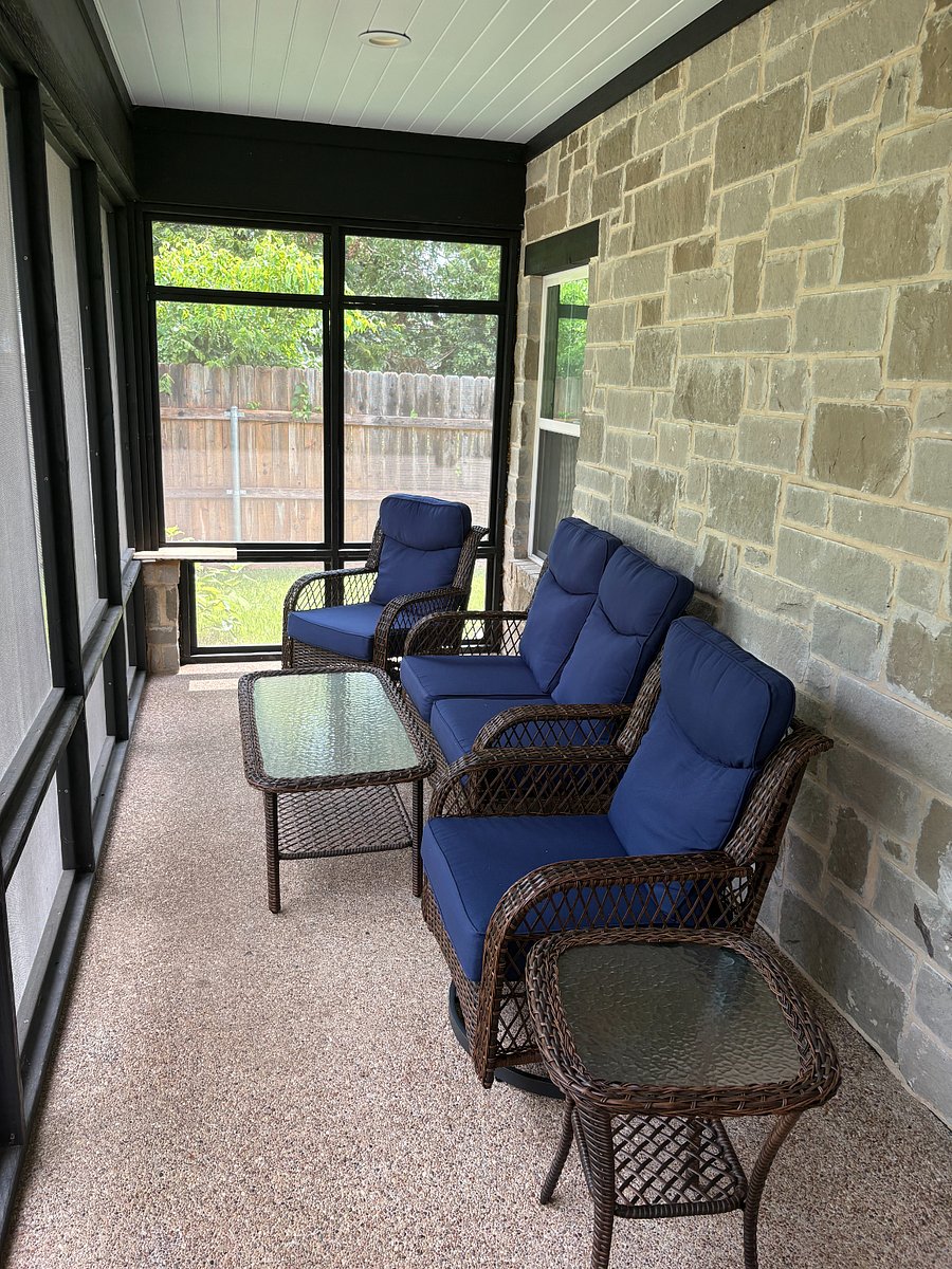 You will love viewing the lush garden and landscaping from the three season porch.