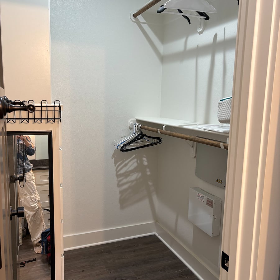Master closet includes built in dresser for storage.