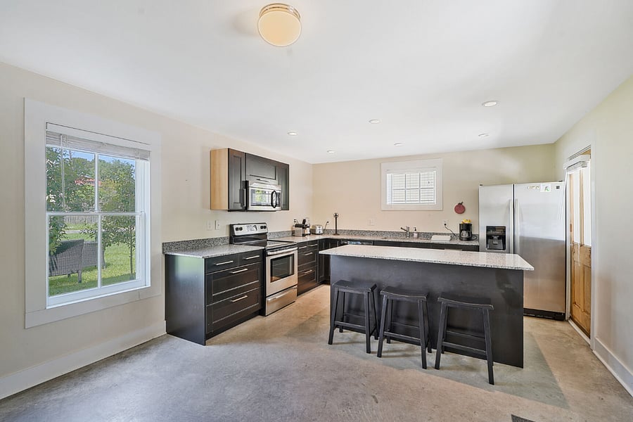 A full kitchen with a great island for cooking, dining, or spreading outeverything you need is here, and feel free to reach out if you have any questions about the appliances.
