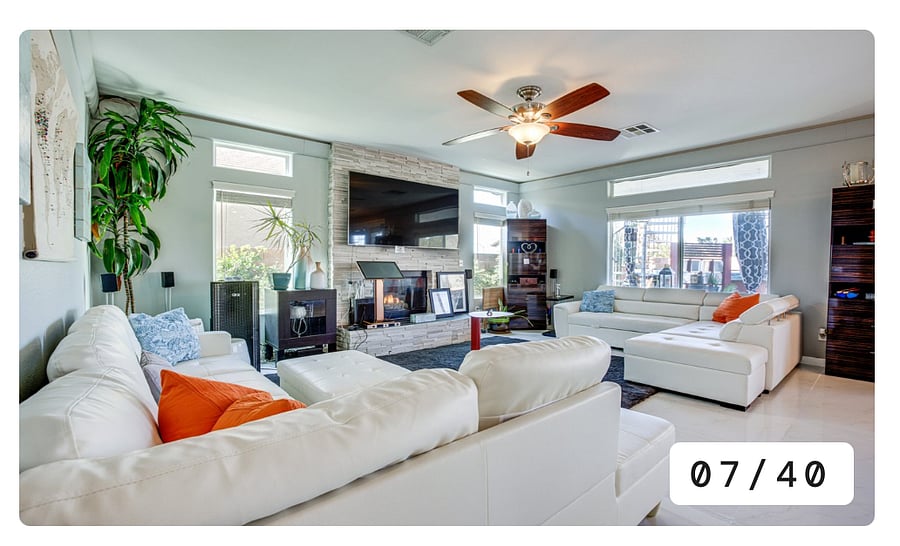Bright, open room with seating for up to 10 people, featuring a 65-inch smart television and cozy gas fireplace to set the mood.