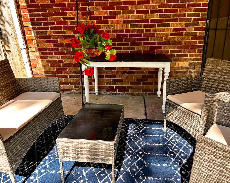 Covered Seating Area in Fenced Backyard