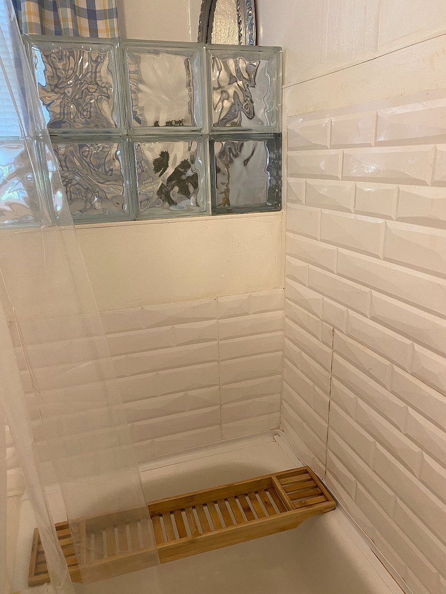 Shower stall with glass block trim.