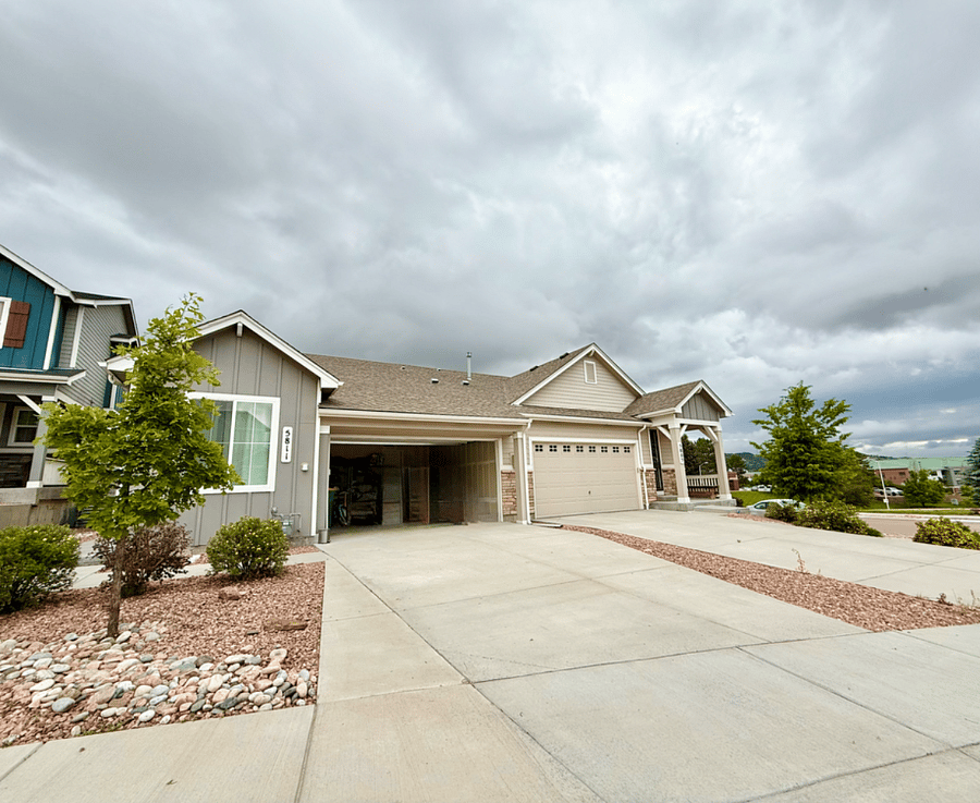 2-car garage and extra parking space on driveway